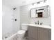 Modern basement bathroom with gray vanity, hexagon tile flooring and shower at 3645 Aldea Dr, Decatur, GA 30032