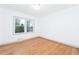 Bright bedroom with hardwood floors and two large windows at 3645 Aldea Dr, Decatur, GA 30032