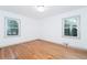 Well-lit bedroom with hardwood floors and double windows at 3645 Aldea Dr, Decatur, GA 30032