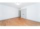 Bright bedroom with hardwood floors and double doors leading to the closet at 3645 Aldea Dr, Decatur, GA 30032