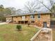 Ranch style home with stone exterior, deck, and spacious yard at 3645 Aldea Dr, Decatur, GA 30032