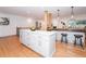 Large kitchen island with white cabinets and quartz countertops at 3645 Aldea Dr, Decatur, GA 30032