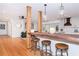 Kitchen island with wooden countertop and metal stools at 3645 Aldea Dr, Decatur, GA 30032