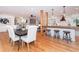 Open kitchen with island, hardwood floors, and modern appliances at 3645 Aldea Dr, Decatur, GA 30032