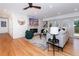 Bright living room with hardwood floors, fireplace, and access to deck at 3645 Aldea Dr, Decatur, GA 30032