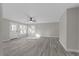 Spacious living room with gray vinyl plank flooring at 449 Dorsey Sw Cir, Lilburn, GA 30047