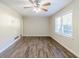 Spacious living area with hardwood floors and large windows at 2543 Brentwood Rd, Decatur, GA 30032