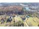 Farmhouse property with lake view and surrounding woods at 3975 Mcconnell Rd, Cumming, GA 30028