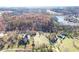 Farmhouse property with lake view and surrounding woods at 3975 Mcconnell Rd, Cumming, GA 30028