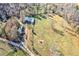 Aerial view showing a barn and additional structures on a large lot at 3975 Mcconnell Rd, Cumming, GA 30028