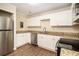 Updated kitchen with white cabinets and granite countertops at 193 Polar Rock Sw Rd, Atlanta, GA 30315