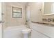 Clean bathroom, granite countertop, and tile shower at 4252 Lamar St, Decatur, GA 30035