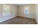 Bright bedroom with neutral walls and carpet at 4252 Lamar St, Decatur, GA 30035