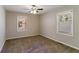 Well-lit bedroom featuring ceiling fan and carpet at 4252 Lamar St, Decatur, GA 30035
