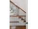 Elegant staircase with dark wood and metal railings at 1025 E Club Ne Ct, Atlanta, GA 30319