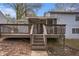 Home's back elevation with deck and screened porch at 676 Tarkington S Rd, Stone Mountain, GA 30088