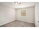 Simple bedroom with a window and neutral walls at 676 Tarkington S Rd, Stone Mountain, GA 30088