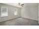 Bright bedroom with neutral walls and carpet at 676 Tarkington S Rd, Stone Mountain, GA 30088