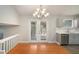 Dining area with hardwood floors and access to the back deck at 676 Tarkington S Rd, Stone Mountain, GA 30088