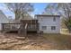 View of house back, deck and surrounding yard at 676 Tarkington S Rd, Stone Mountain, GA 30088