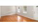 Bright living room with hardwood floors and neutral walls at 676 Tarkington S Rd, Stone Mountain, GA 30088