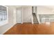 Spacious living room featuring hardwood floors and a view of the upper level at 676 Tarkington S Rd, Stone Mountain, GA 30088