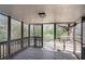 Screened porch with wooden deck overlooking backyard at 676 Tarkington S Rd, Stone Mountain, GA 30088