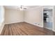 Bright living room with wood-look floors and ceiling fan at 3986 Holland Dr, Douglasville, GA 30135