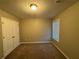 Simple bedroom with carpet, closet and window coverings at 1206 St James Pl, Loganville, GA 30052