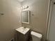 Bathroom with vanity, toilet, and mirror at 5423 Pine Valley Dr, Union City, GA 30291