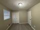Bright bedroom featuring a window, closet, and neutral decor at 5423 Pine Valley Dr, Union City, GA 30291