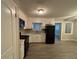 Eat-in kitchen with white cabinets and black appliances at 5423 Pine Valley Dr, Union City, GA 30291