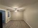Living room with ceiling fan and wood-look flooring at 5423 Pine Valley Dr, Union City, GA 30291