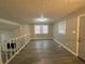 Spacious living room with fireplace and wood-look flooring at 5423 Pine Valley Dr, Union City, GA 30291