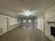 Large living room with fireplace and wood-look flooring at 5423 Pine Valley Dr, Union City, GA 30291