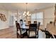 Bright dining room with a round table and hardwood floors at 2060 Old Georgian Nw Ter, Atlanta, GA 30318