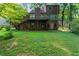 Spacious backyard with large deck and wooded area at 839 Post Road Way, Stone Mountain, GA 30088