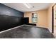 Unfinished basement room with dark wall and flooring at 839 Post Road Way, Stone Mountain, GA 30088