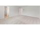 Bright bedroom featuring carpet and an adjacent bathroom at 7065 Brushwood Bnd, Lithonia, GA 30058