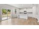 Kitchen with white cabinets, granite countertops, and island at 7065 Brushwood Bnd, Lithonia, GA 30058