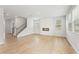 Spacious living room with hardwood floors and fireplace at 7065 Brushwood Bnd, Lithonia, GA 30058