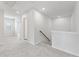 Upstairs hallway with carpet and access to bedrooms at 7065 Brushwood Bnd, Lithonia, GA 30058