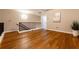 Open loft area with hardwood floors, neutral walls, and natural light at 2626 Peachtree Nw Rd # 412, Atlanta, GA 30305