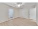 Well-lit bedroom with wood-look flooring and ceiling fan at 706 Dunbar Dr, Dunwoody, GA 30338