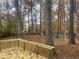 Wooded backyard view from deck, showcasing autumn foliage at 1312 Buttercup Ct, Lawrenceville, GA 30044