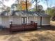 Home with deck and fenced-in backyard at 2490 Brentwood Rd, Decatur, GA 30032