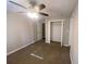 Spacious bedroom with ceiling fan, carpet, and double-door closet at 2490 Brentwood Rd, Decatur, GA 30032