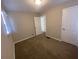 Bright bedroom with neutral walls and carpet at 2490 Brentwood Rd, Decatur, GA 30032