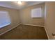Well-lit bedroom with neutral walls and carpet at 2490 Brentwood Rd, Decatur, GA 30032