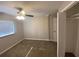 Bedroom with ceiling fan, carpet, and a large closet at 2490 Brentwood Rd, Decatur, GA 30032